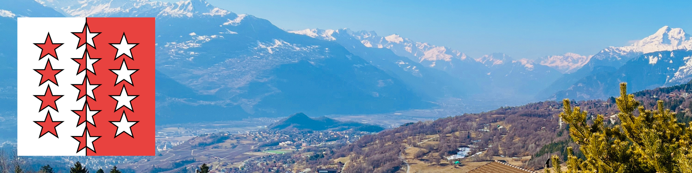 Paysage du Valais avec montagnes enneigées et vallée, représentant la localisation du poste à Sion (VS).